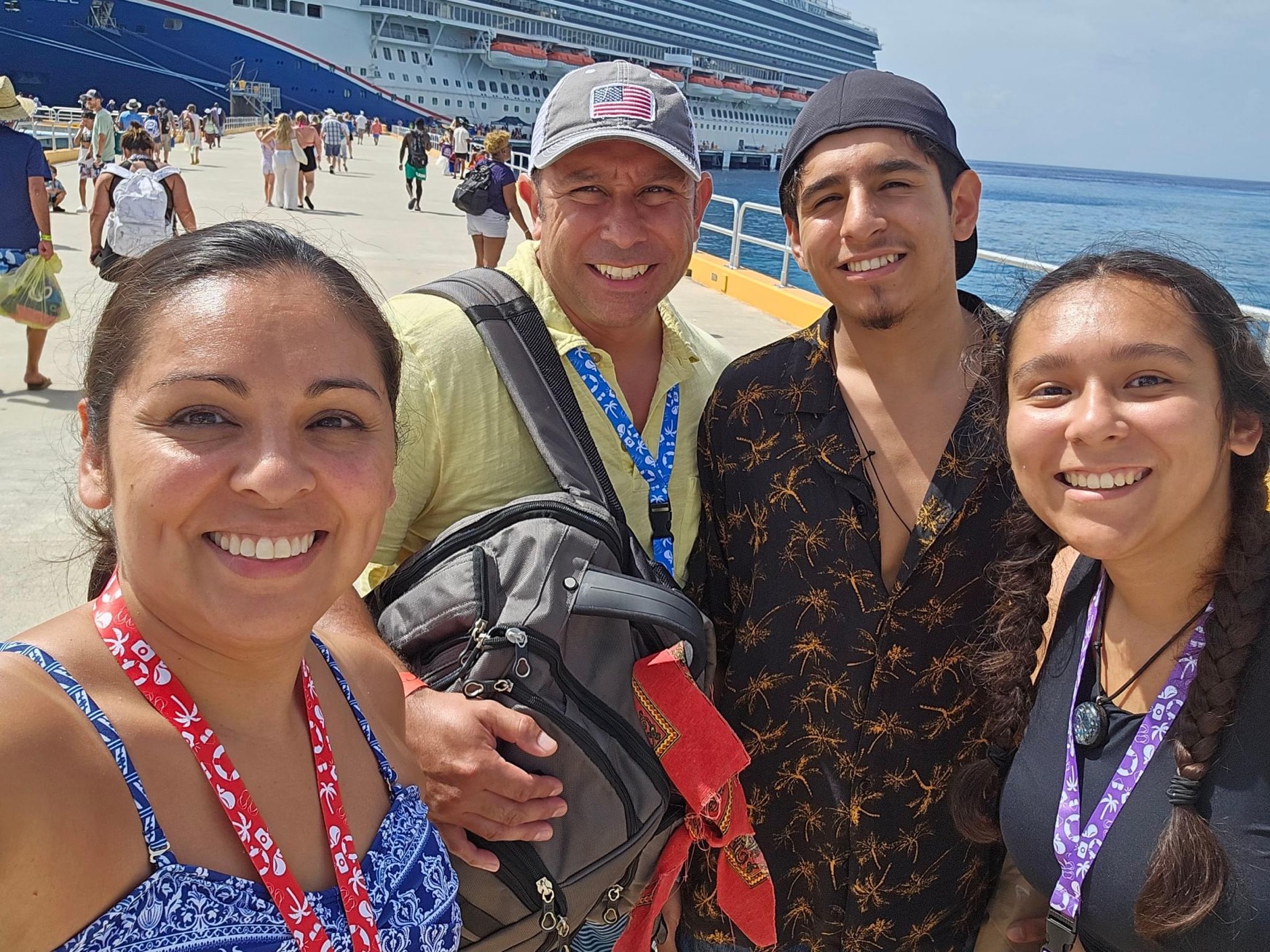 Photo of a family in front of cruise ship