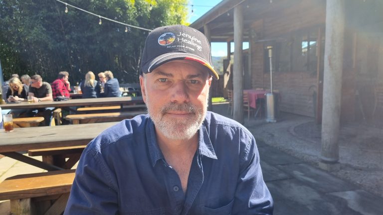 Photo of Marvin Schneider enjoying the sunshine in an boutique brewery outdoor beergarden