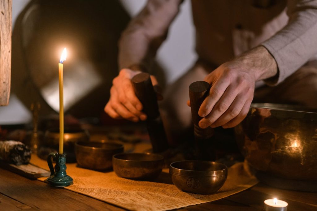 Image of a person playing a singing bowl