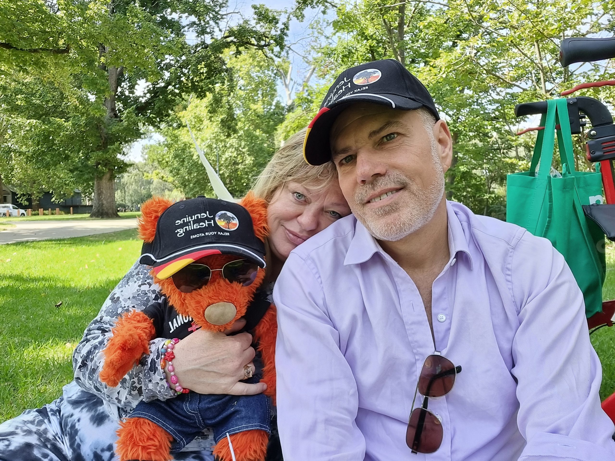 Photo of Jen Ward and Marvin Schneider with their healing bear Darshan