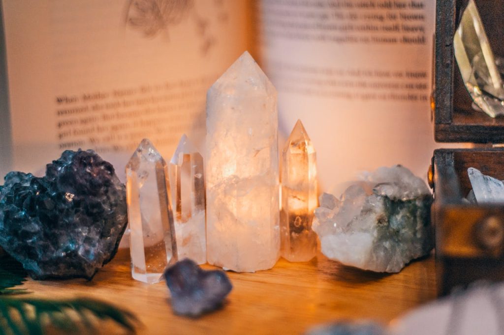 Photograph of crystals with background ambient light on a wooden table